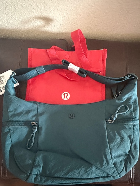 lululemon athletica Handbags - lululemon athletica slouchy sling bag 6L
Color : warp teal